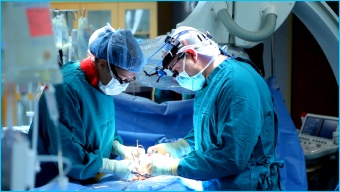 Surgeon performing operation on Crohn's disease