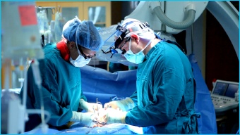 Surgeon performing operation on Crohn's disease